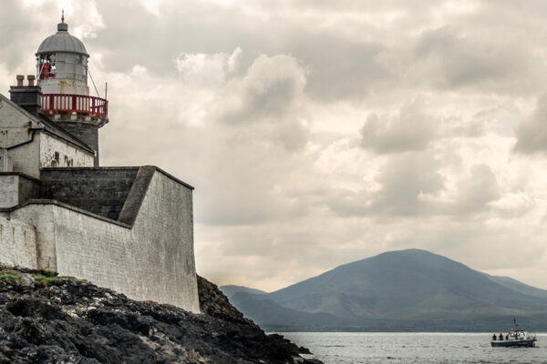 Fenit Lighthouse and boat