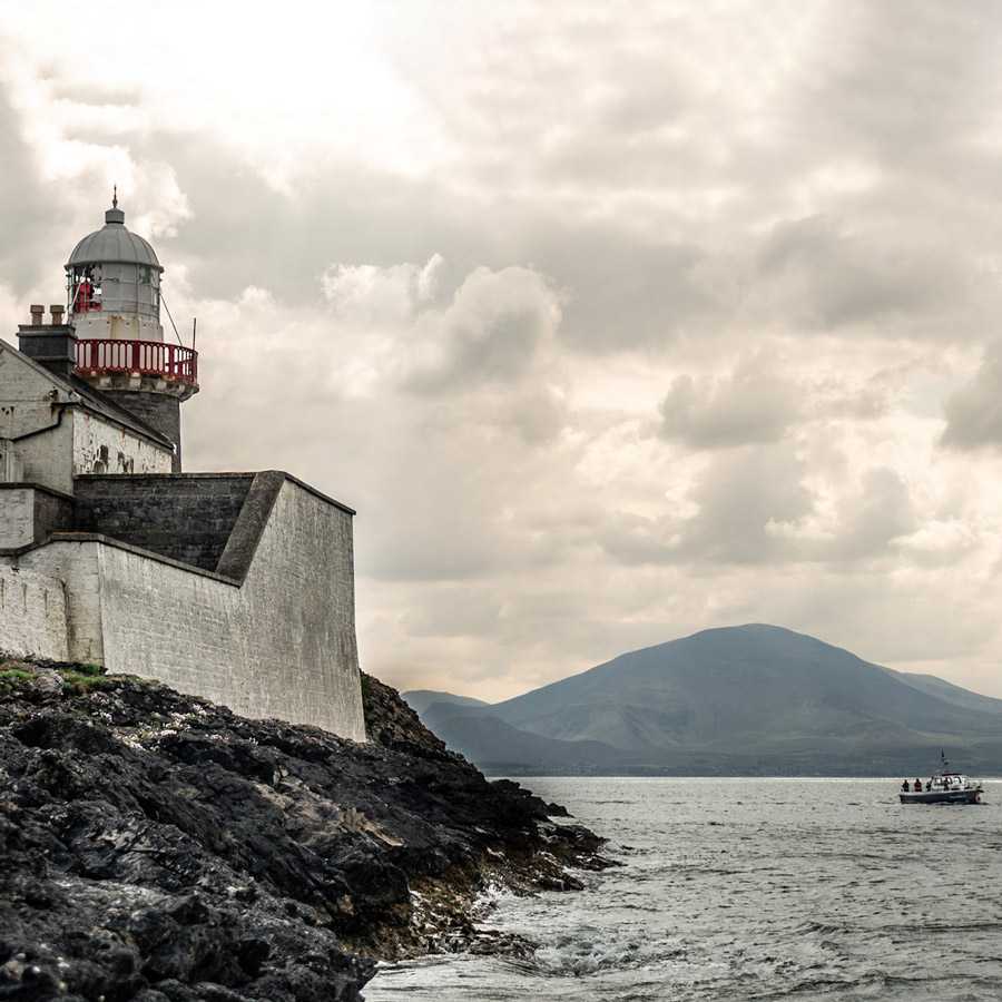 Fenit Lighthouse and boat