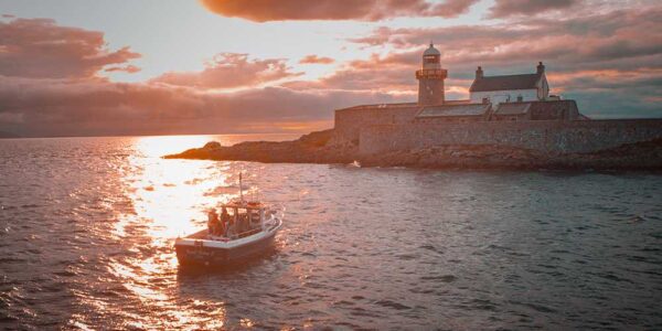 Fenit Lighthouse & Boat at Sunset