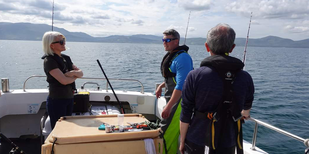 men on boat for survey